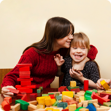 happy-girl-with-down-syndrome-toys